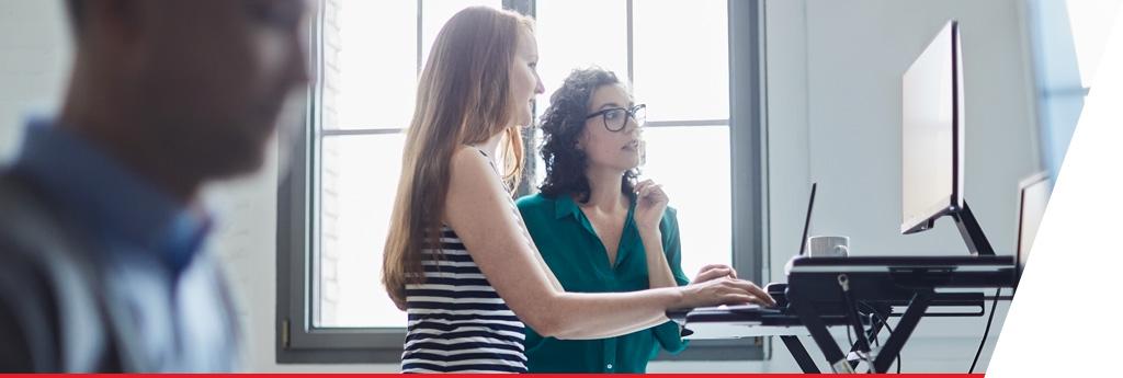 Women working at ergonomics office desk | CNA Insurance