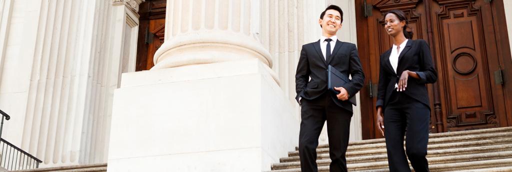 Lawyers walking up steps in business attire | CNA Insurance