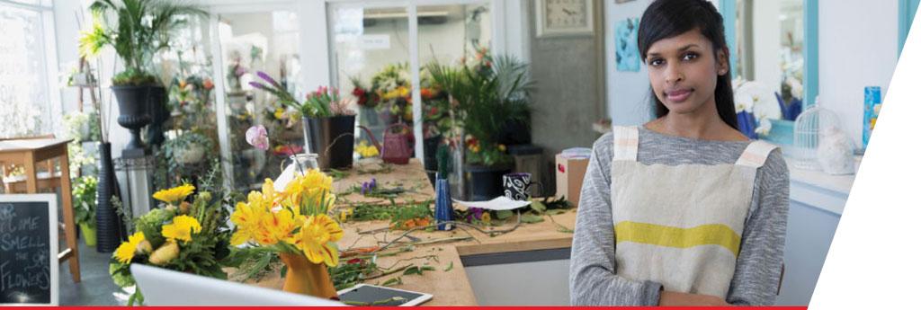 Female florist at small business flower shop | CNA Insurance