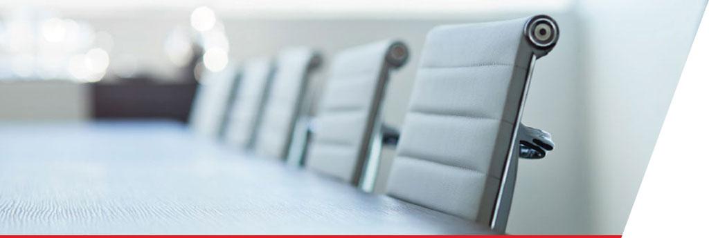 Empty office chairs in board room | CNA Insurance