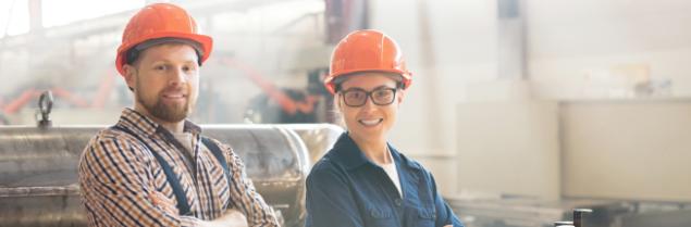 Workers in factory smiling | CNA Insurance