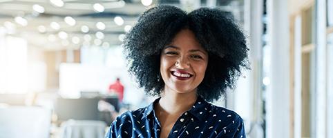 Successful female employee with arms crossed | CNA Insurance