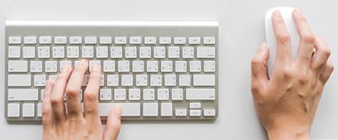 Person using keyboard and mouse | CNA Insurance