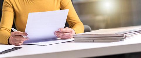 Female taking notes at table | CNA Insurance