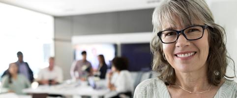 Businesswoman in team meeting | CNA Insurance