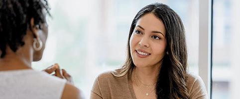 Two women talking in an office